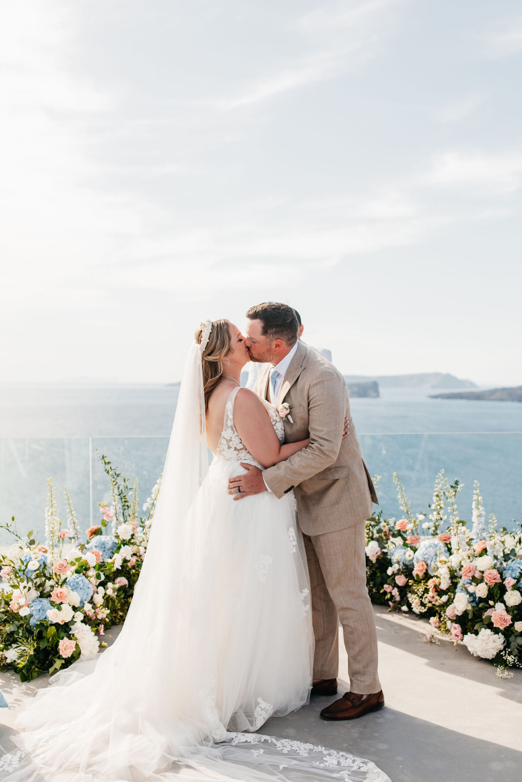 Couple kisses during their destination wedding ceremony