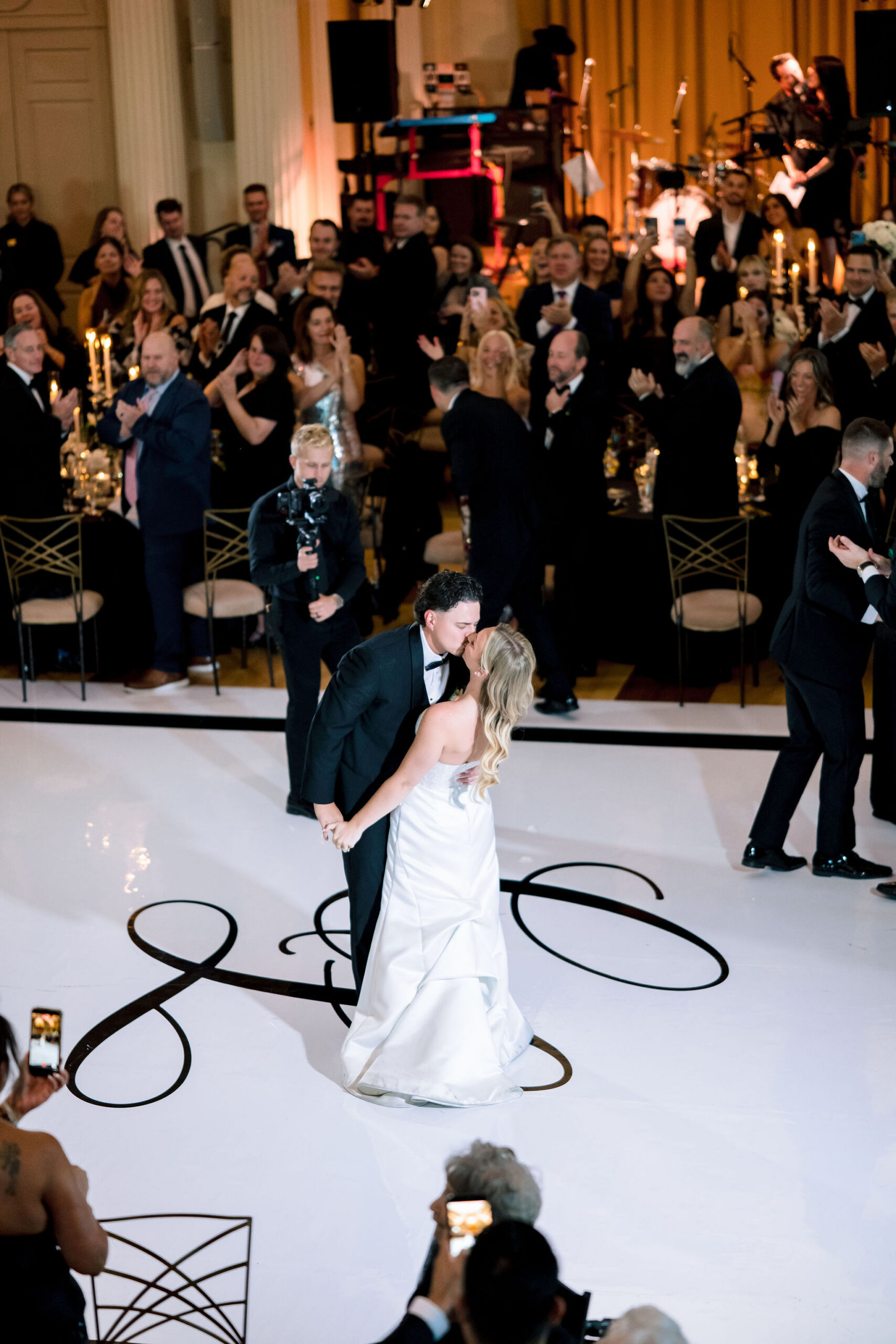 Couple kisses at their Medinah Country Club wedding reception